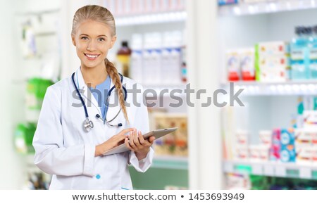 Stock photo: Portrait Of A Female Pharmacist At Pharmacy