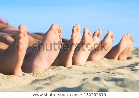 Foto stock: Feet Of Family At The Beach