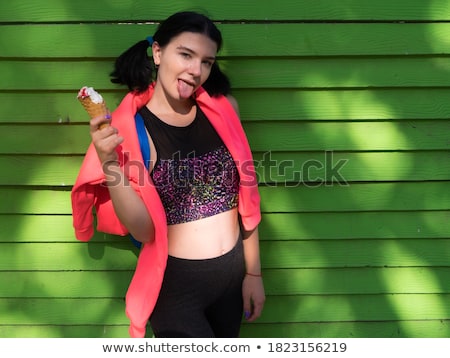 Stock photo: Portrait Of A Young Brunette Beauty Over Green Wall