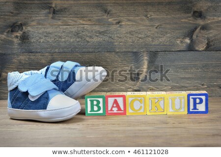 Stok fotoğraf: Kid Shoes And Word Backup