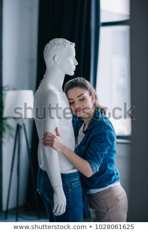 Stock photo: Woman Hugging Mannequin