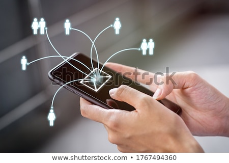 [[stock_photo]]: Businessman Sending Bulk Messages Using Smartphone