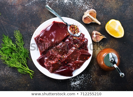 ストックフォト: Raw Liver On Slate Board On Wooden Background Top View