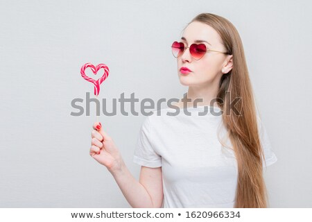 Stok fotoğraf: Pretty Woman Hold Love Sign Pink Heart On Stick