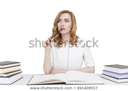 Stok fotoğraf: Pensive Red Haired Teenage Girl Studying At The Table