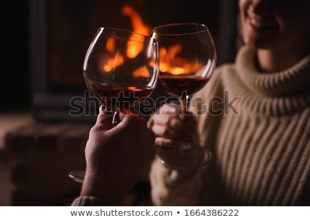 Stock photo: Hands Of Couple Clinking Red Wine Glasses