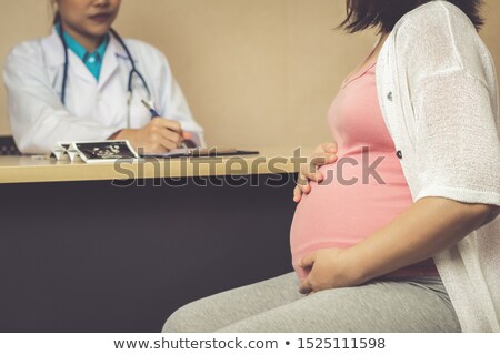 Stockfoto: Pregnant Woman Visiting Doctor For Consultation