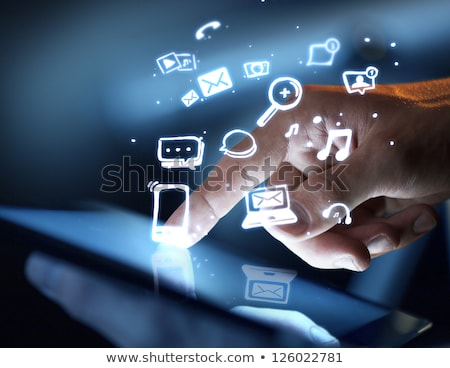 Stock photo: Finger Touching Tablet With Social Media Icons Concept