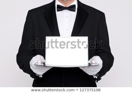 Mayordomo con tarjeta en blanco en bandeja Foto stock © RTimages