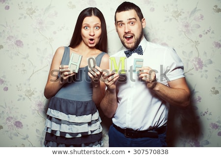 A Pregnancy And People Concept Happy Man Pregnant Woman At Home Stock photo © Augustino