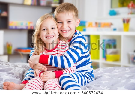 Foto stock: Brother And Sister Together In Bed