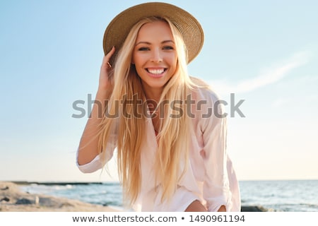 Foto stock: Blond Woman Relaxing In The Sea