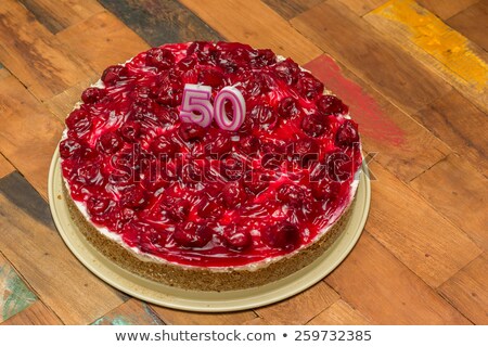 Сток-фото: Cherry Cheese Cake With Candles For 50th Birthday