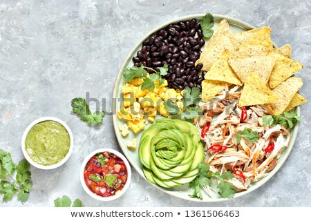 Foto stock: Mexican Nachos Chips And Tacos With Meat Beans And Salsa