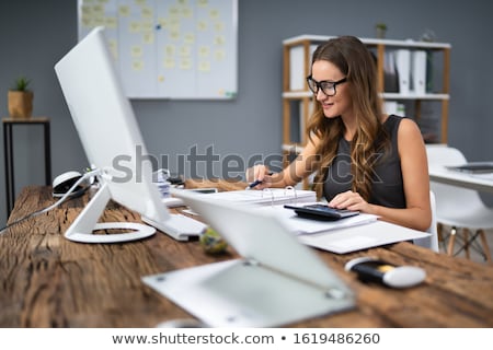 Stock photo: Businesswoman Calculating Bill