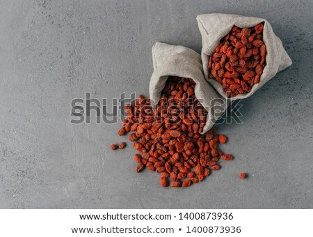 Stock fotó: Healthy Goji Berries Spilled Out Of Small Sack Isolated Over Grey Background Agriculture And Nutri