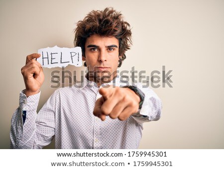 Foto stock: Young Serious Businessman Pointing At Camera