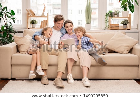 Famille sur canapé 2 [[stock_photo]] © Pressmaster