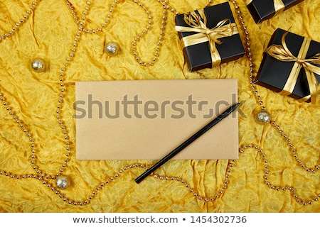 ストックフォト: Black Gift Boxes With Gold Ribbon And Blank Sheet Paper