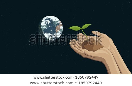 Foto stock: Two Hands Holding A Sprout Representing Sustainability