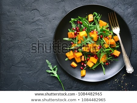 Foto stock: Delicious Salad With Arugula And Baked Pumpkin