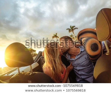 Stok fotoğraf: Happy Newlyweds Kissing In Cabrio