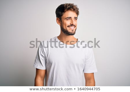 [[stock_photo]]: Face Of A Young Casual Man Smiling Looking To Side