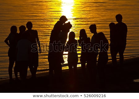 ストックフォト: Group Of Young People Having Fun On The River Bank