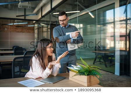 Stock photo: Young Female Employee Being Fired From Her Work