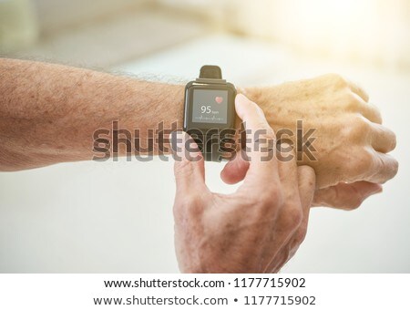 Foto stock: Crop Senior Man Measuring Pulse With Smart Watch