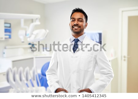 Foto stock: Indian Dentist In White Coat At Dental Clinic