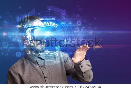 Foto stock: Businessman Looking Through Virtual Reality Glasses Tech Concept
