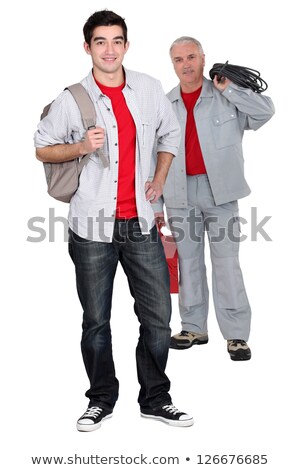 [[stock_photo]]: Apprentice Electrician And Senior Craftsman Standing Together