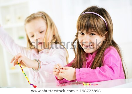 Little Girl Making Jewelry Zdjęcia stock © MilanMarkovic78