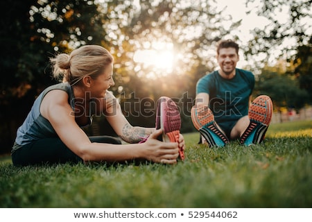 Stock fotó: Stretch Exercises In Park