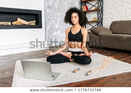 ストックフォト: Woman Practicing Yoga