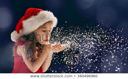 Stock photo: Santa Girl Blowing Snow