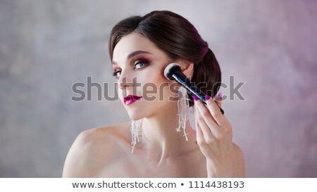 [[stock_photo]]: Portrait Of Beautiful Brunette Girl Doing Makeup