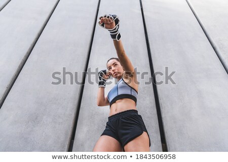 Foto stock: Low Angle View Of A Fit Caucasian Boxer