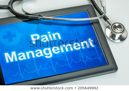 Foto stock: Tablet With The Text Pain Management On The Display