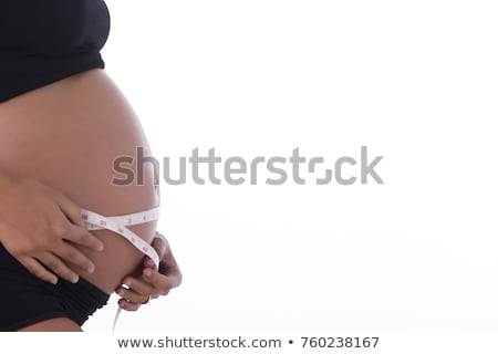 Stock foto: Woman Abdomen With Measuring Tape Over Black Background