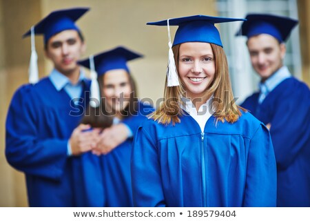 Foto stock: Girl In Blue Graduation Gown