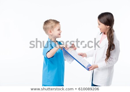 Zdjęcia stock: Side View Of Smiling Surgeons In Medical Uniform Looking At Each Other On White