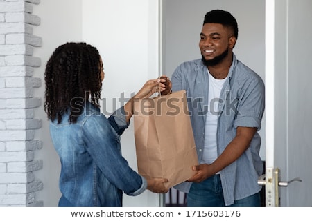 Stock foto: Delivery Courier Delivering Groceries To Customer
