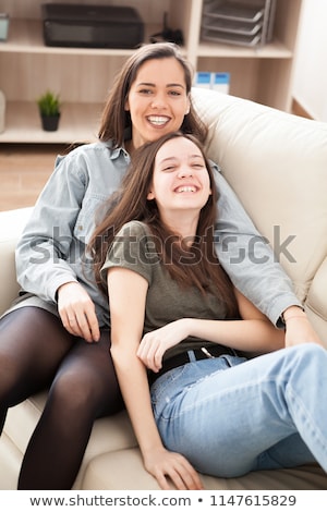 Stock foto: The Oldes Sister Is Cuddling The Younger One