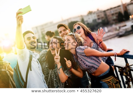 Foto stock: Group Of Happy Friends Taking Selfie By Cell Phone