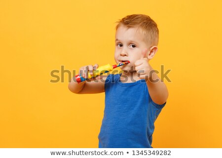 Stock foto: Three Little Childs Brushing Teeth Isolated On White