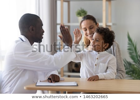 Stockfoto: A Cute Child Patient Visiting Doctors Office
