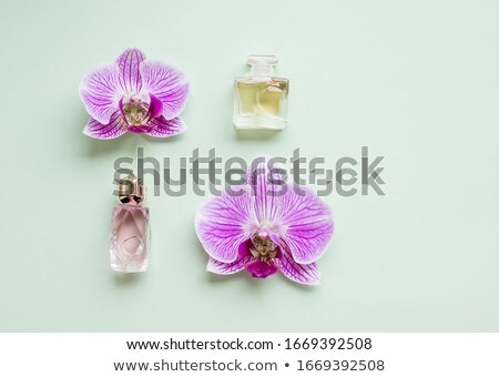 Stock photo: Floral Scent Perfume Sprayer With Orchid Flower