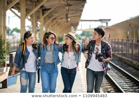 Foto stock: Friends Or Travelers Hiking With Backpacks And Map